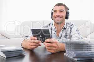 A man listening to cds