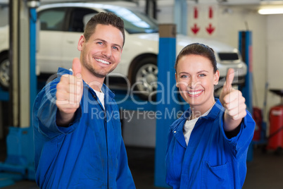 Team of mechanics smiling at camera