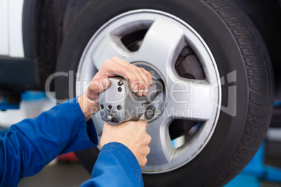 Mechanic adjusting the tire wheel