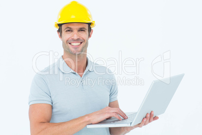 Carpenter using laptop  over white background