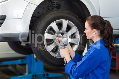 Mechanic adjusting the tire wheel