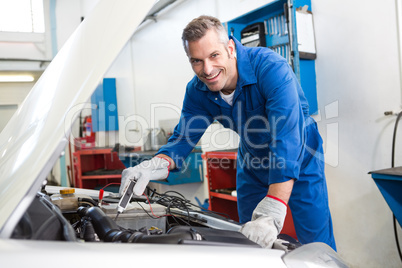 Mechanic working under the hood