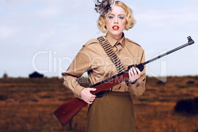 Stylish Girl Scout with Gun at the Field