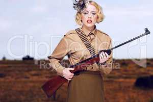 Stylish Girl Scout with Gun at the Field