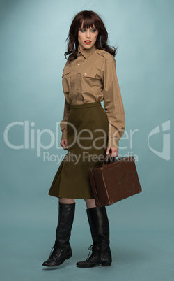Fashionable Young Woman Carrying Suit Case