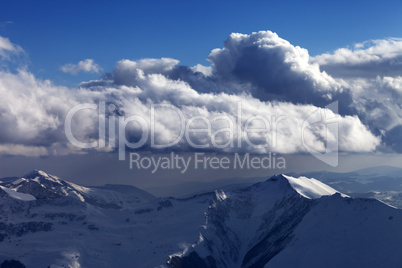 Winter mountains in nice evening and sunlight clouds