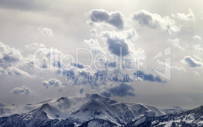 Evening mountains and sunlight cloudy sky