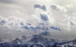 Evening mountains and sunlight cloudy sky