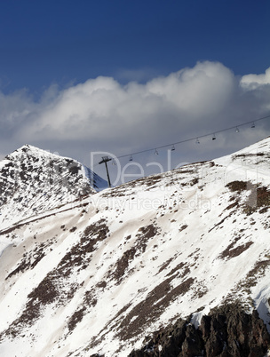 Off-piste slope and chair-lift in little snow year