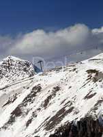 Off-piste slope and chair-lift in little snow year