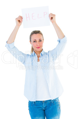 Pretty blonde holding help sign