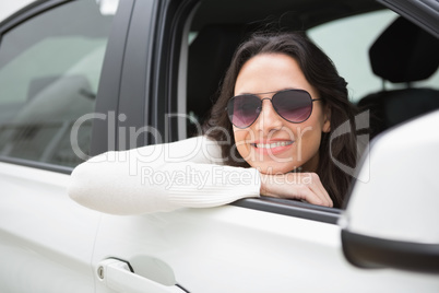 Woman wearing sunglasses smiling at camera