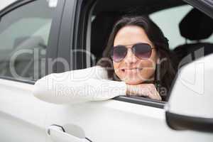 Woman wearing sunglasses smiling at camera