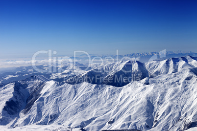 Winter snowy mountains in sun morning