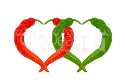 Red and green chili peppers in love. Hearts composed of peppers.