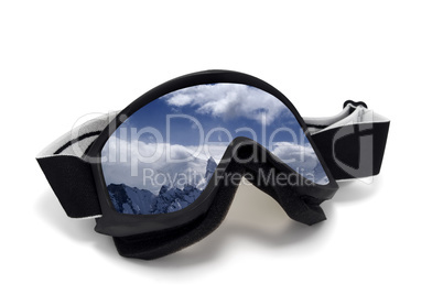 Ski goggles with reflection of cloudy mountains