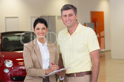 Smiling businesswoman speaking with her client