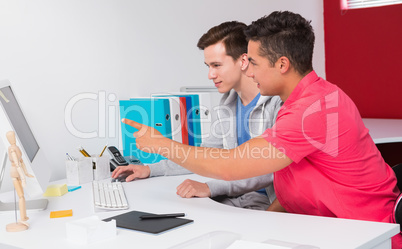 Students working together on computer Students working together on computer