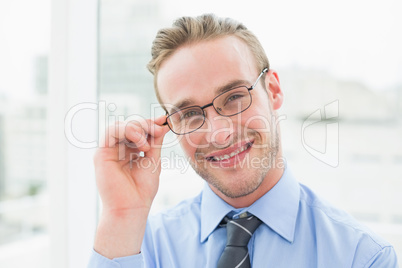 Portrait of smiling businessman with glasses