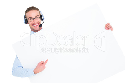 Businessman showing card wearing headset