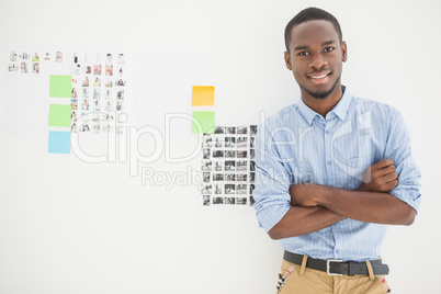 Portrait of smiling businessman with arms crossed