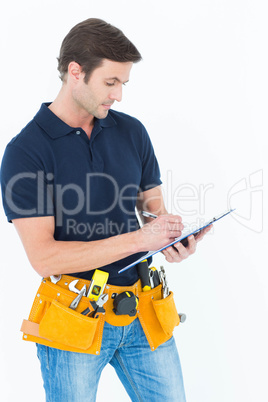 Carpenter writing on clipboard over white background