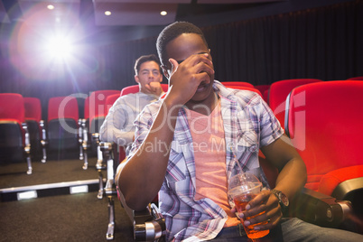 Young friends watching a film