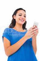 Smiling woman sending a text message