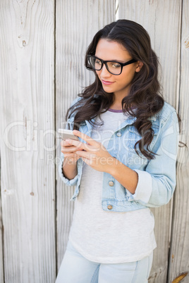 Pretty hipster sending a text