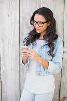 Pretty hipster sending a text