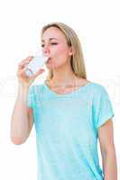 Pretty blonde drinking glass of water