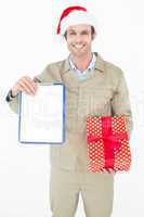 Delivery man in Santa hat holding clipboard and gift