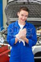 Mechanic wiping hands with rag