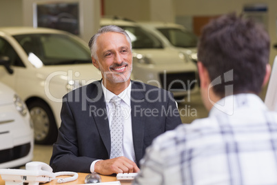 Salesman speaking with a client