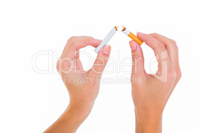 Womans hands snapping a cigarette