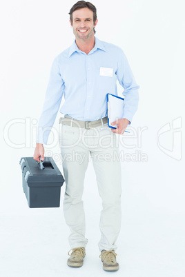 Happy supervisor carrying tool box and clipboard