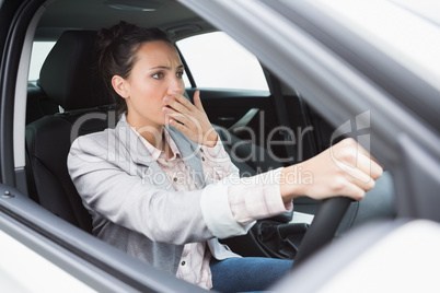 Nervous businesswoman crashing her car