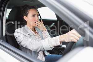 Nervous businesswoman crashing her car