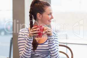 Young woman having a coffee