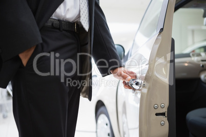 Man opening a car door