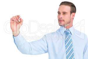 Concentrated businessman in shirt writing with marker