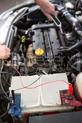 Mechanic working under the hood