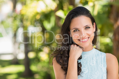 Stylish brunette smiling at camera