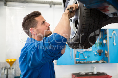 Mechanic adjusting the tire wheel