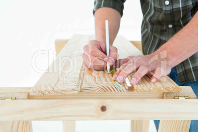 Carpenter marking on wooden plank