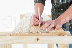 Carpenter marking on wooden plank