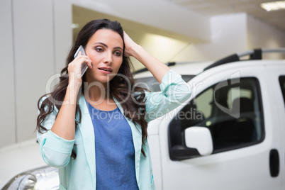 Upset woman calling someone with her mobile phone