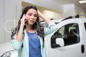 Upset woman calling someone with her mobile phone