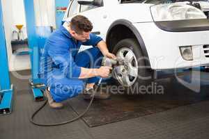 Mechanic adjusting the tire wheel