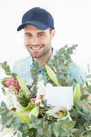 Happy delivery man with bouquet